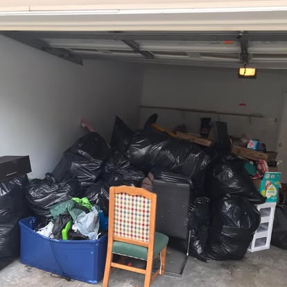 Garage full of trash bags before