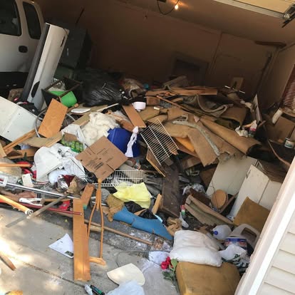 Garage with junk spilling out before